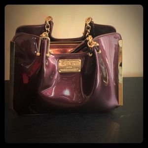 Bebe faux patent leather glossy handbag